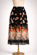 Jupe élégante noire à imprimé floral, taille L.