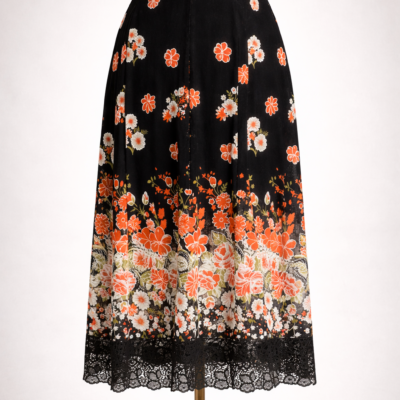 Jupe élégante noire à imprimé floral, taille L.